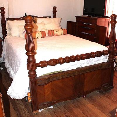 Antique bed on casters
