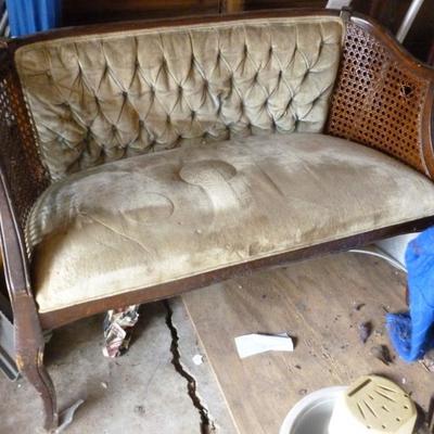 Antique caned and upholstered settee