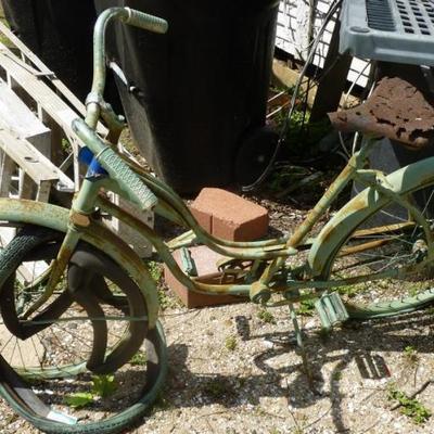 Old green bicycle, perfect for the garden
