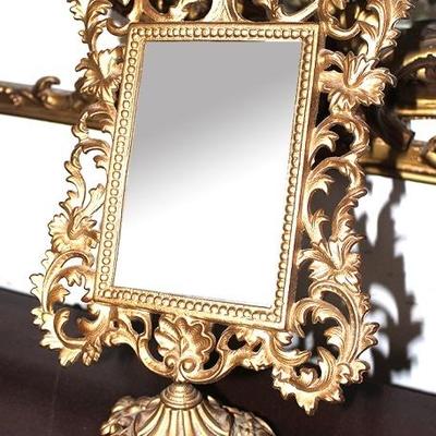 Gold leaf mirror on stand

