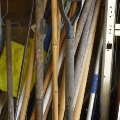 Box lot of garden tools, tiki torches, shovels, ho
