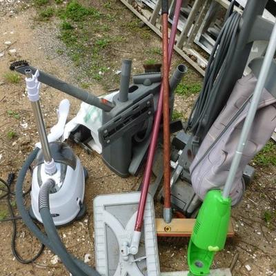 Box lot of vacuums, brooms, etc.
