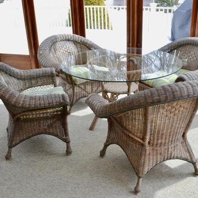 Glass top table and 4 wicker armchairs
