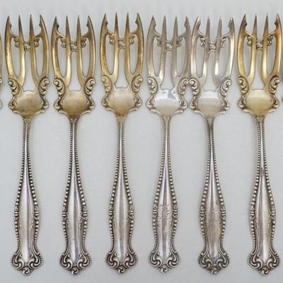 8 Rare Sterling Silver 1893 Salad Forks in the Canterbury Pattern by Towle Silversmiths. Ornate, each measures 6