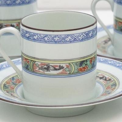 Eight sets of Puiforcat, Paris Demitasse Flat Cups and Saucers in the very hard to find Kan Sou Pattern with Celandon Background....