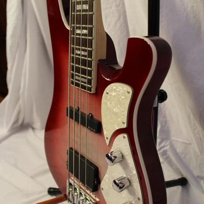 Item #7 Schecter Diamond Series Stargazer Bass Guitar

Price: $930.00

Description:
Dexterity:	Right-Handed	
Body Color:	Red
String...