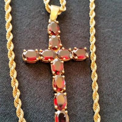 Gold and ruby cross and chain.