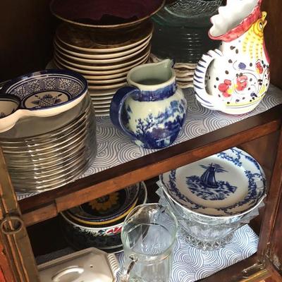 Assortment of blue/white porcelain plates, dishes, and dining accessories 