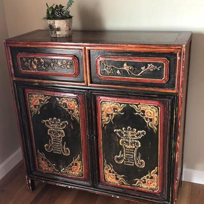 Chinese Chest (features intricate painted surfaces, two drawers and opening doors) This truly eclectic piece is a masterpiece in its own...