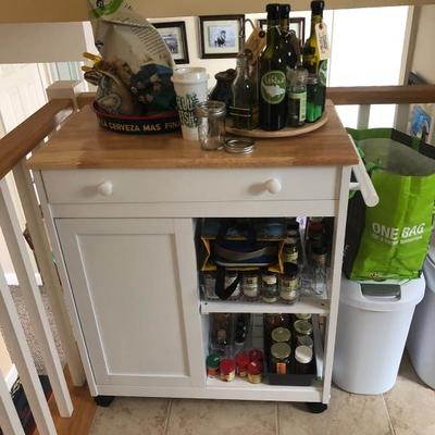Kitchen pantry cart! Featuring adjustable wheels, wood top and storage space!