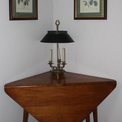 Antique Cherry Wood Drop Side Handkerchief Style Gate Leg Table shown with a Federal Style 3-Light Candlestick Lamp with Black Metal Shade 