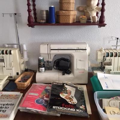 Janome sewing machine and 2 sergers - close up