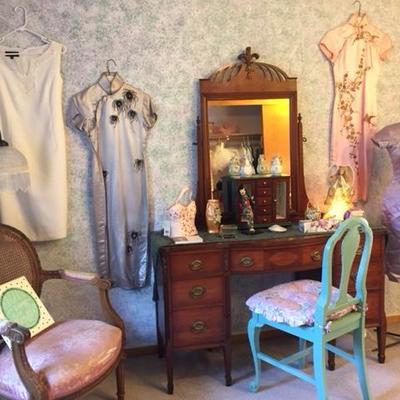 Antique vanity with vintage clothing