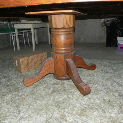 Oak pedestal table with leaf and 6 matching chairs. $250.00  