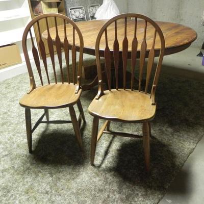Oak pedestal table with leaf and 6 matching chairs. $250.00  