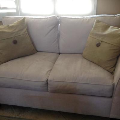 Pair of love seats and ottoman