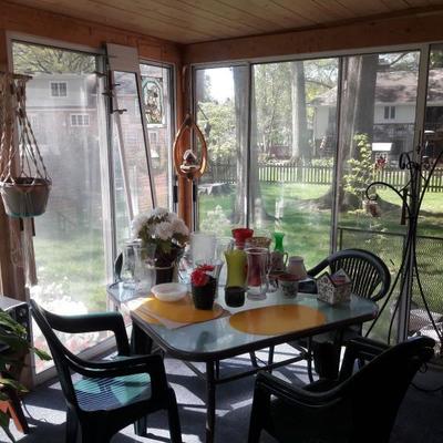 Clear top patio table and resin chairs