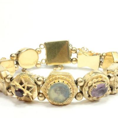 Lot 220: Yellow Gold Charm Bracelet 