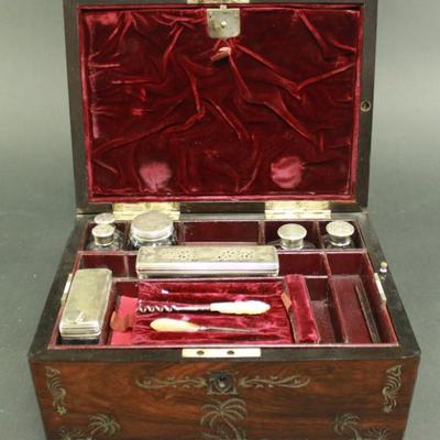 Lot 151: 9-Piece Traveling Kit with Sterling Silver Covers 