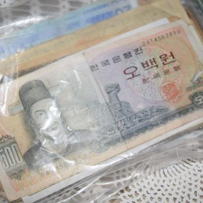 Thousands of dollars worth of Foreign Currency, obsolete & current