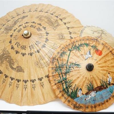 Three Vintage Chinese Hand Painted Rice Paper Parasols. Each handcrafted parasol features a bamboo frame.Cranes and dragons. 