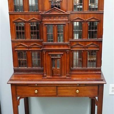 A Maitland-Smith Dollhouse Drinks Cabinet. Late 20th century, labeled, mahogany, two part form, upper display cabinet having Georgian...