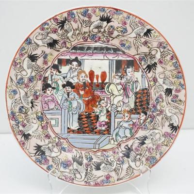 Chinese Enameled Porcelain Plate. Preening and flying crane border, Imperial courtyard family scene. Mark on bottom in Zhuanshi reads Da...