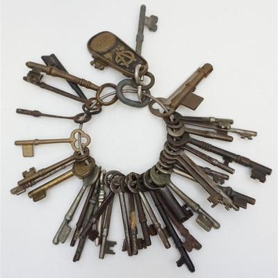 Large group of 34 Antique Skeleton Keys. Including Vintage 1930 Bronze Room Fob and Key from Hotel George V in Paris. 