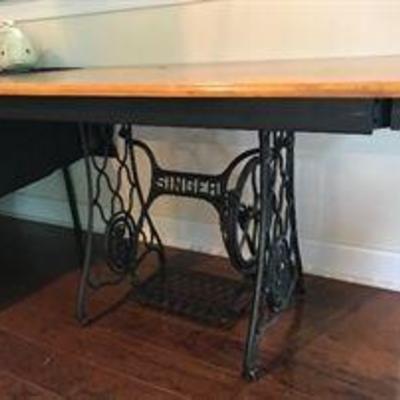 Repurposed SINGER wrought iron base. Works and the wheel spins when you step on it. Converted into a breakfast table. $350.