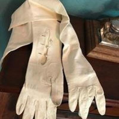 Vintage long white leather opera gloves with 3 buttons. Asking: $50.