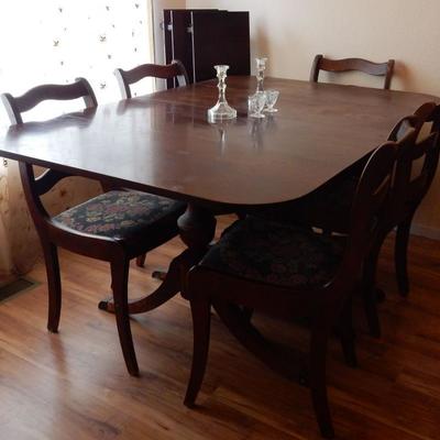 3 leaf and six chairs included.