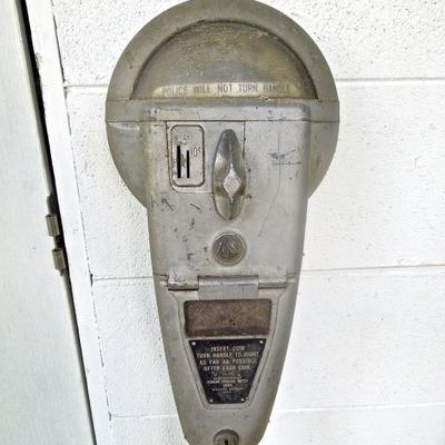 Two 1960's Duncan parking meters with poles. Another just meter.