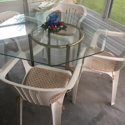 Glass Table, $40, 4 plastic patio chairs, $20 for all 4