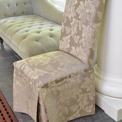 One of two damask chairs