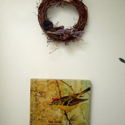 Print of bird on canvas and grapevine wreath