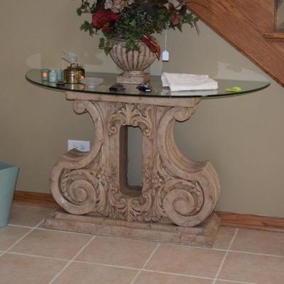 Stone base-glass top console table, floral centerpiece