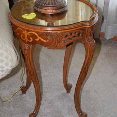 Round glass-top side table