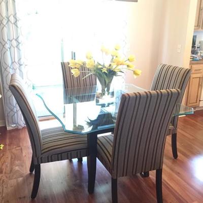 Glass top dining table w/ 4 chairs $495