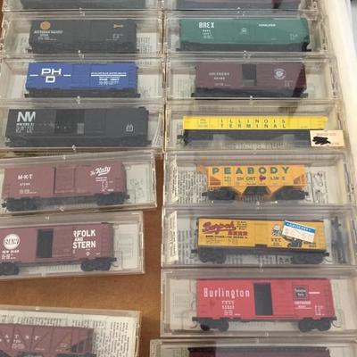 N Scale micro trains.   Buildings. Tracks   Magazines. Transformer. 
