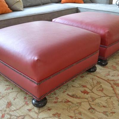 Pair of red leather ottomans