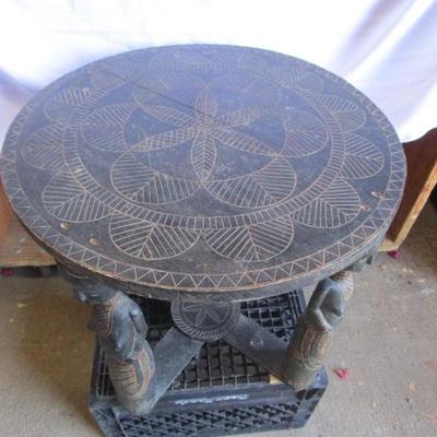 African hand made side table with incredible etchings