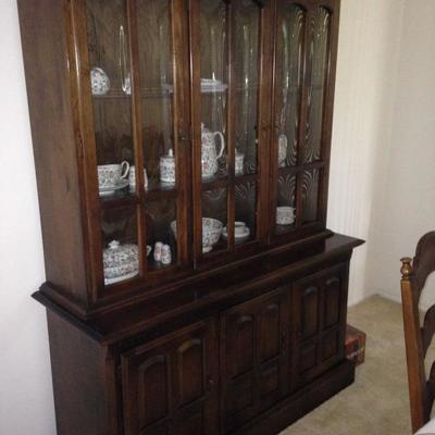 China cabinet matches dining table and side table.