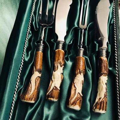 ROSTFREI 4-piece set. Carved stag antlers as handles.