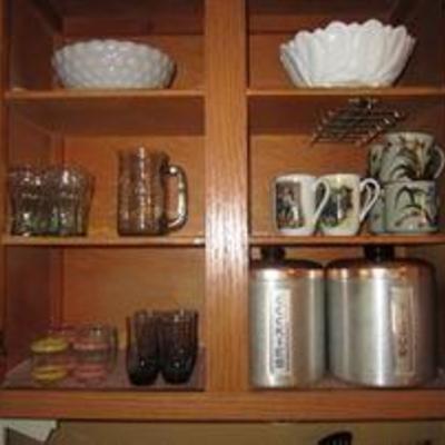 Kitchen items- glassware, vintage canisters, mugs, bowls,