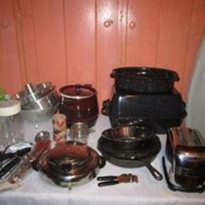 Kitchen items- enamel roaster, cast iron pan, pots, toaster, bowls, 