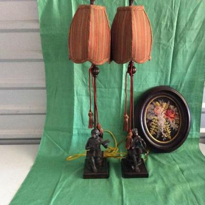 Tall Brass Musical Monkey Lamps and Oval-Framed Needlepoint
