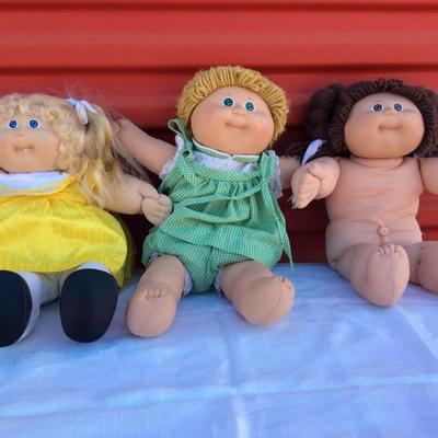 Two Cabbage Patch Dolls and One Cabbage Patch Kid