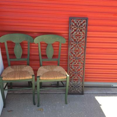 Two Wood Chairs and Two Metal Decorative Wall Hangings