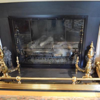 Brass andirons and fireplace fender