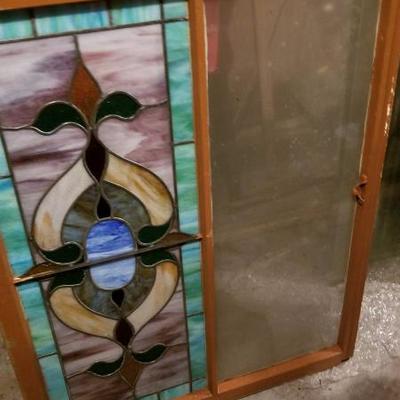 pair of matching stain glass windows